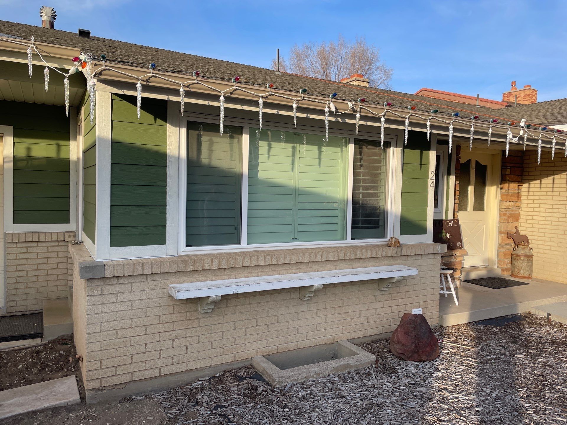 Exterior prep and repaint result on an older Bountiful home with updated siding and trim