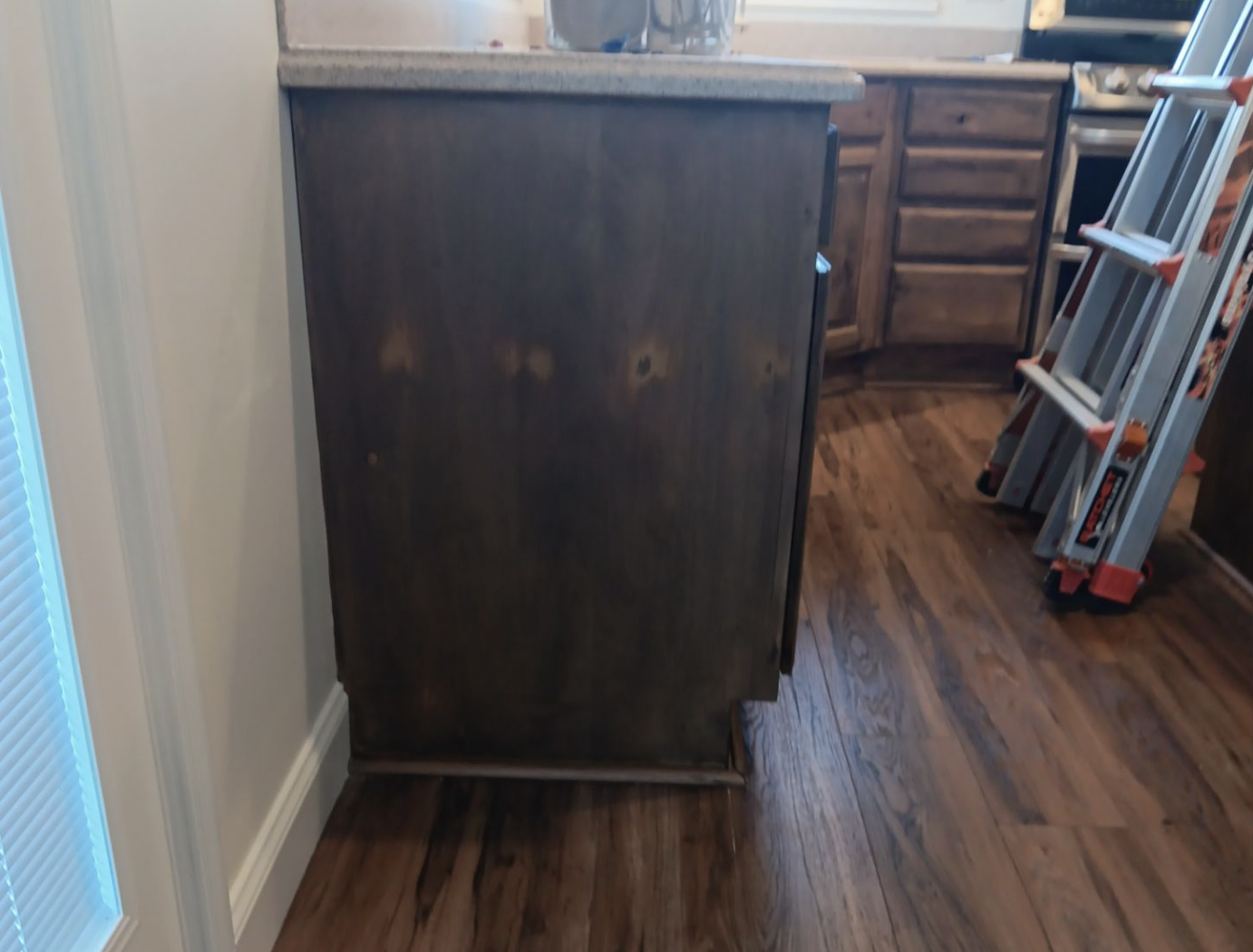 Syracuse cabinet refinishing project with stained cabinets matched to wood flooring